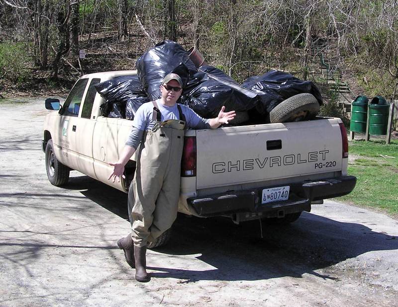 Wade with pickup truck full of trash