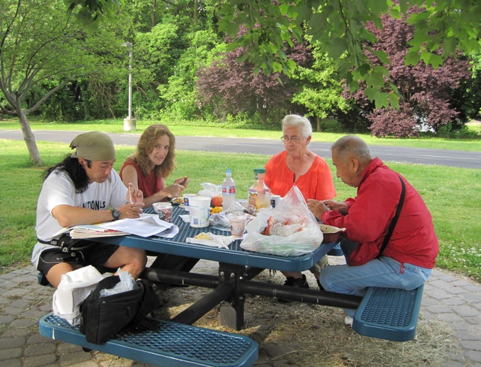 Norma, Hazel, Dad, and I eating breakfast outside