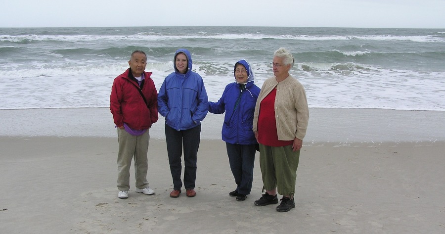 Dad, Norma, Mom, and Hazel with ocean behind