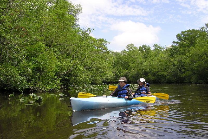 Mom and Norma in a blue tandem kayak