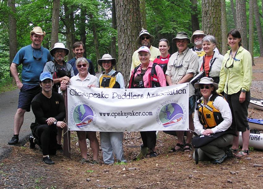 Photo of group around CPA sign