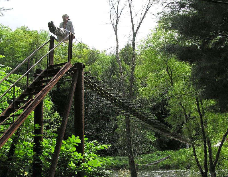 Me holding a pike position on the bridge support