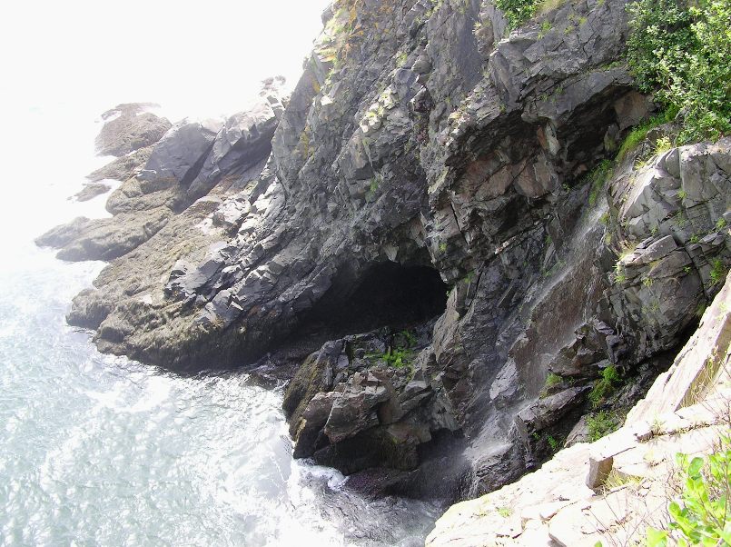 Rocky cave at water's edge