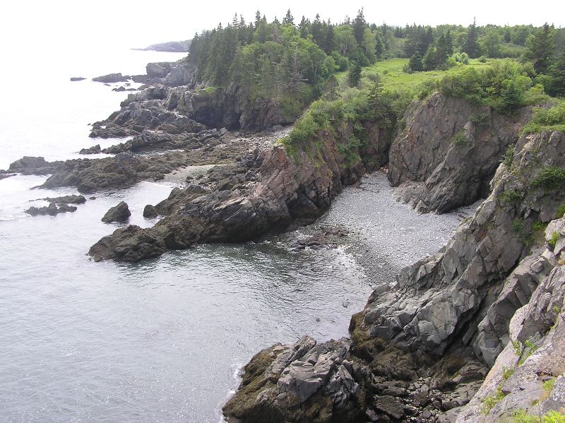 Looking down on a rocky coast with gravel beach