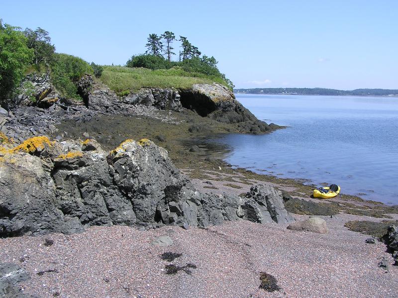 My kayak on a gravelly beach on rocky Popes Folly