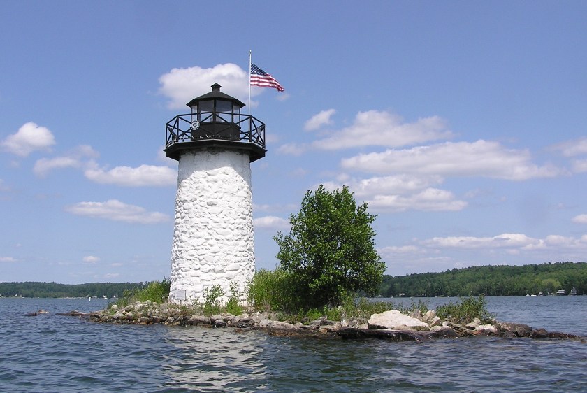 Small white lighthouse on small island