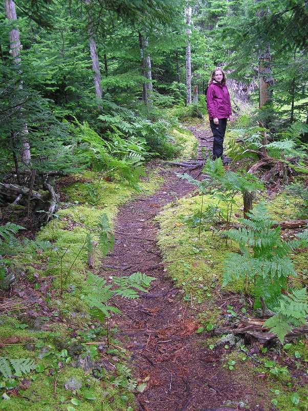 Norma on a mossy, wooded trail