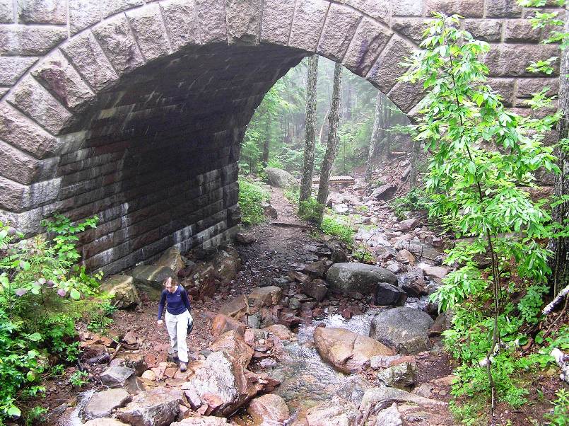 Norma by a stone bridge that is not Little Harbor Brook Bridge