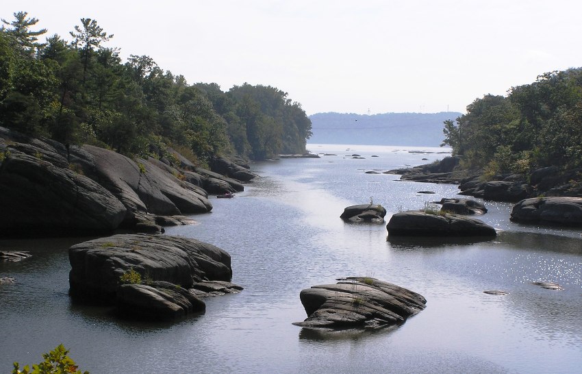 Big rocks in the water and shore, looking downstream