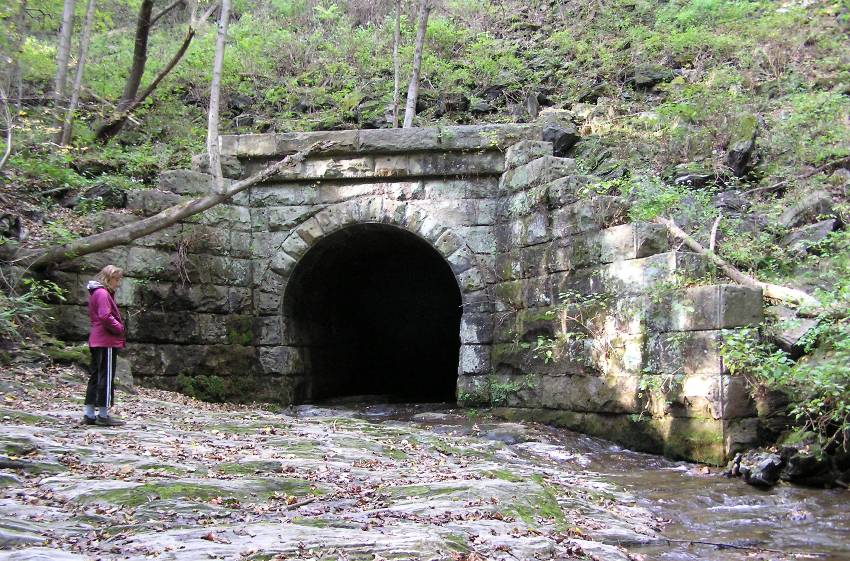 Norma at a well-constructed tunnel for a creek