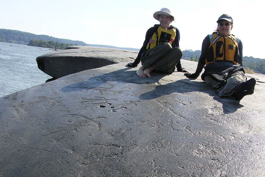 Norma and Suzanne on a wet rock that shows the drawings quite nicely in the right light