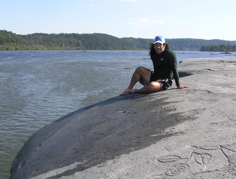 Me on the same rock with a modern carving shown in the lower right of the photo