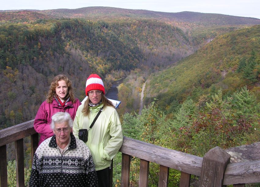 Norma, Joyce, and Hazel looking serious with valley behind