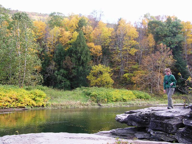 Joyce at rocky outcropping by the water