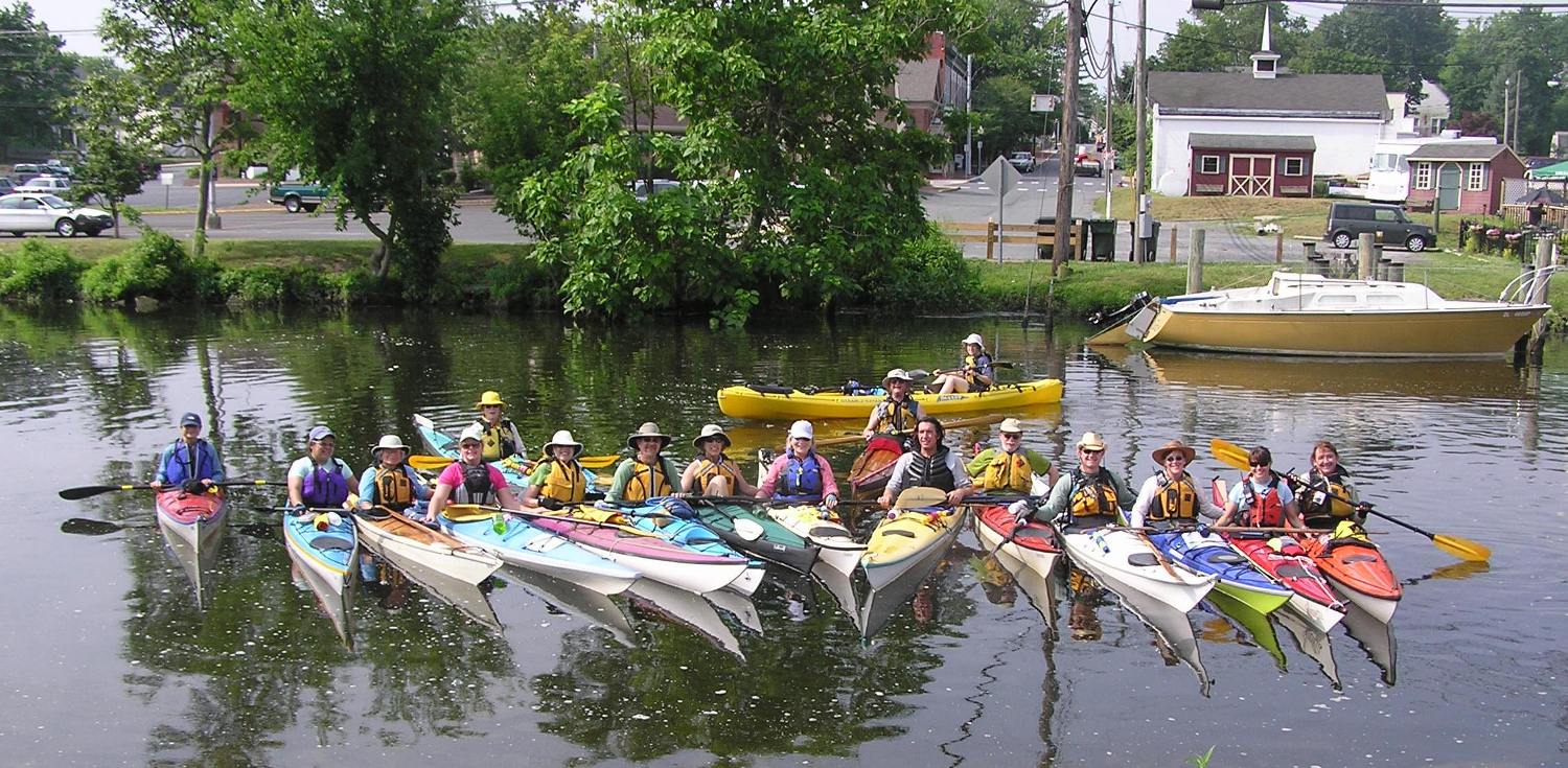 Group photo of kayakers on the water