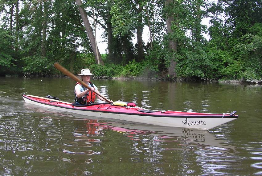 Jennifer kayaking in red kayak