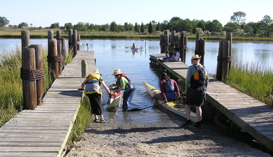 Folks launching, looking towards the water