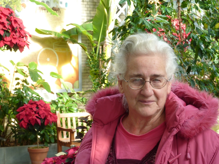 Hazel in front of poinsettia flowers