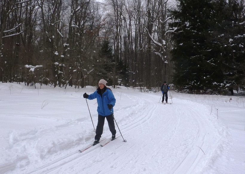 Carmen making her way down a gentle downhill with Clark following behind