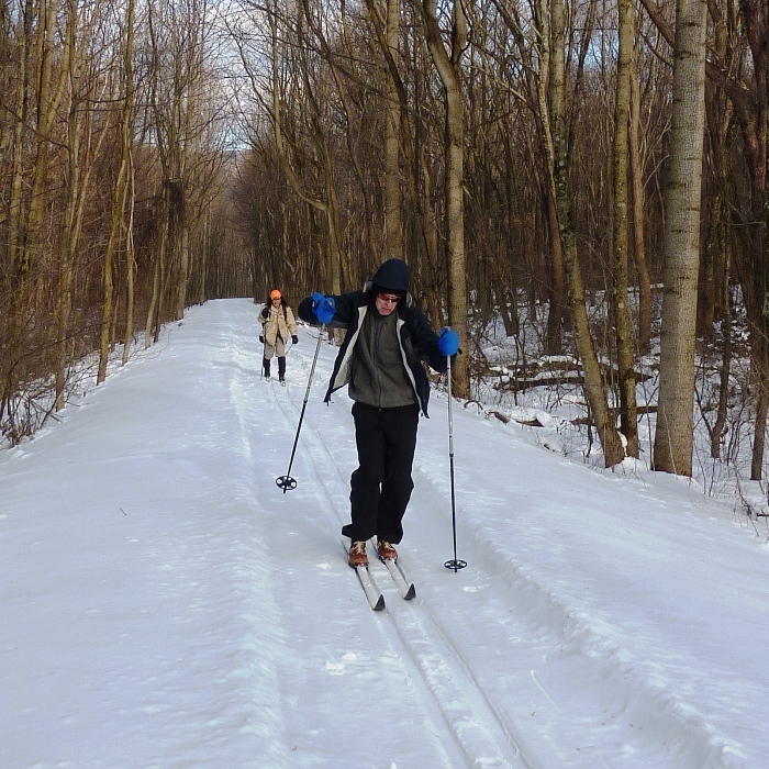 Clark skiing hard with me behind