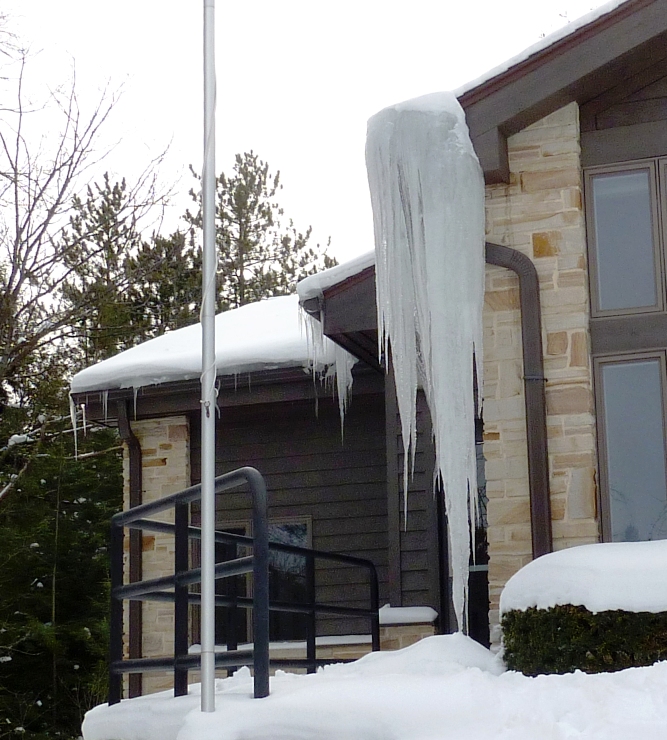 Big icicle hanging off the side of a building