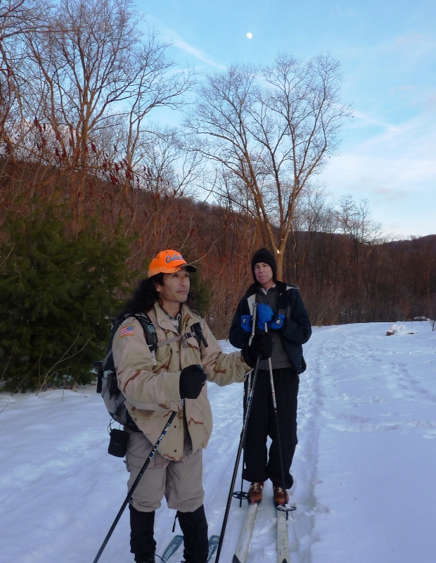 Clark and I standing with a rising moon behind us