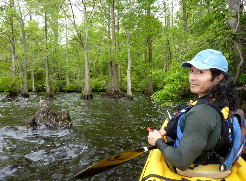 Me with cypress trees behind