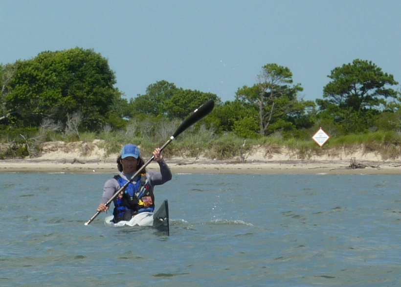 Me paddling away from sign warning of explosives