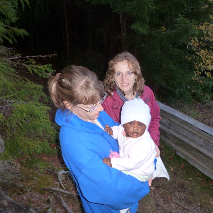 Joyce holding the baby with Norma behind