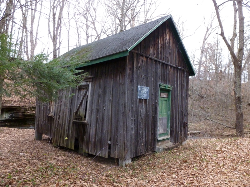 Old, unpainted, wooden election house building