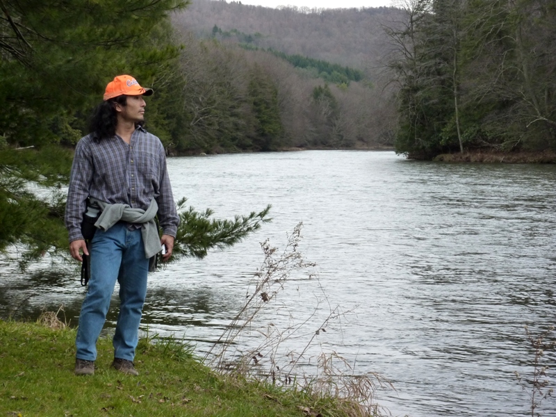 Me standing next to slow moving water