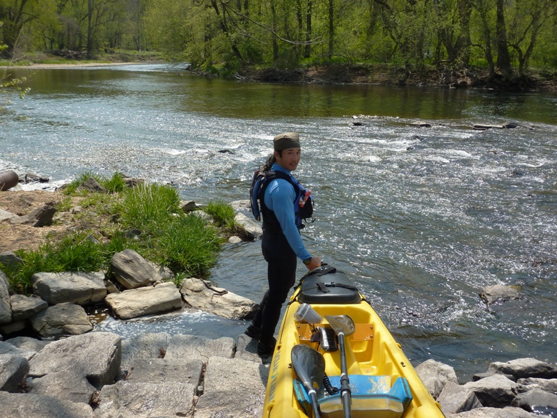 Me with the kayak, standing by the shore