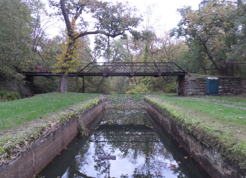 Bridge, canal, and porta-john