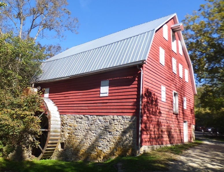 McMahons Mill, a red building with a waterwheel