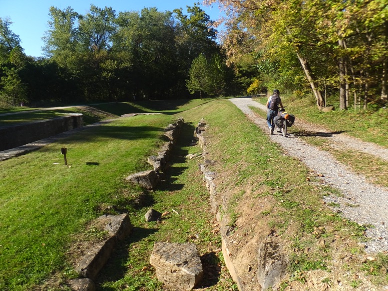 Carmen walking bike near lock