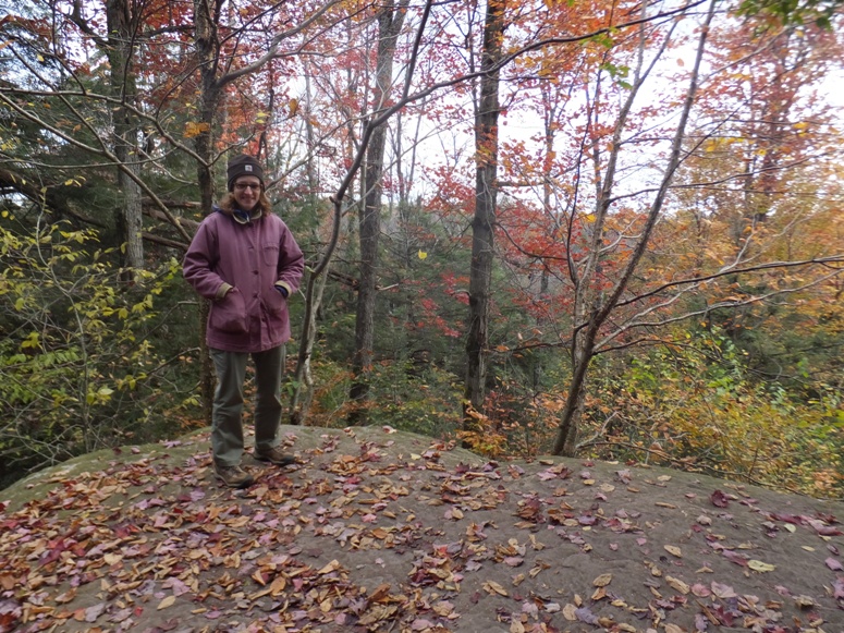 Norma standing on a big, flat rock