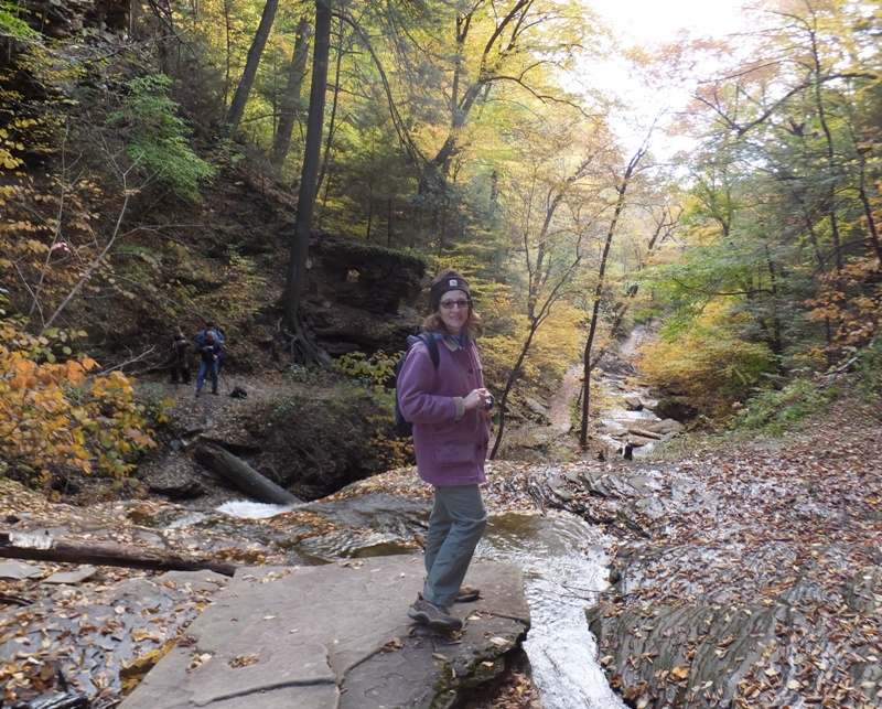 Norma standing at the top of the waterfall