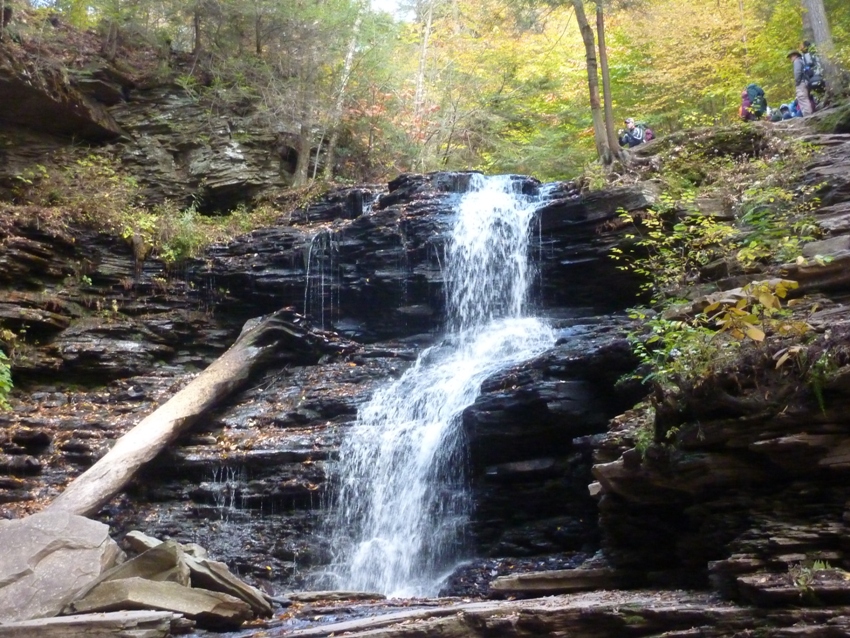 Rocky waterfall with people at the top