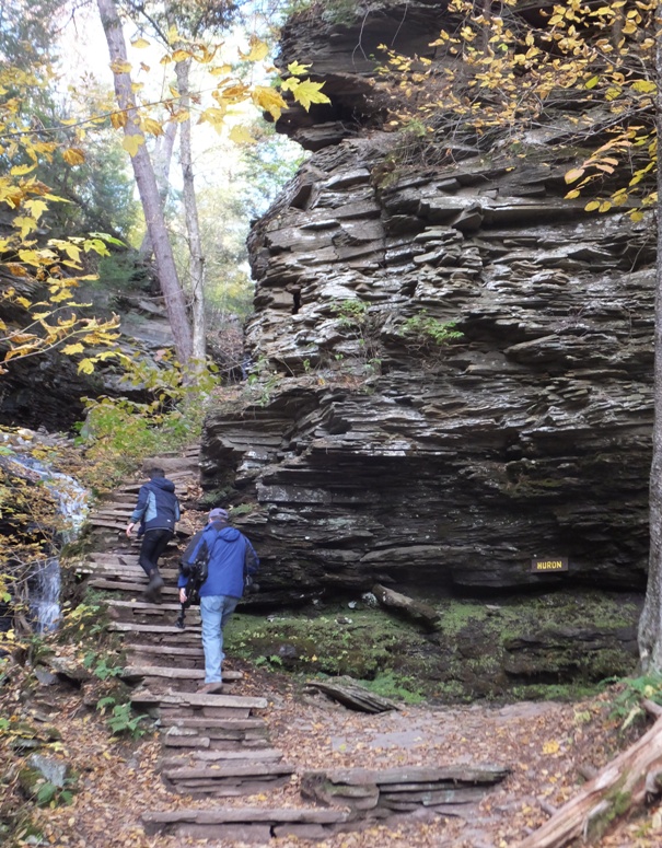 People climbing stairs to get to the top