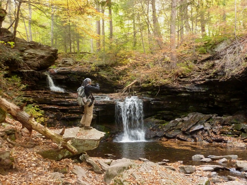 Me taking a picture of the waterfall with yellowy lighting