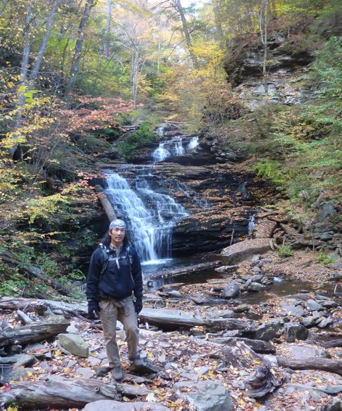 Me in front of the falls with the log right behind