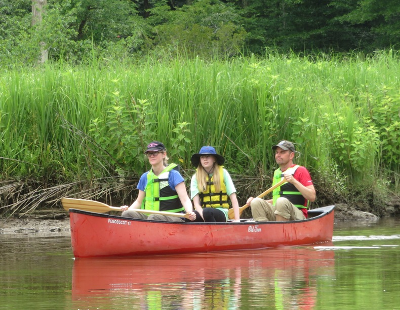 Allison, Viviana, Mark, and April in a canoe