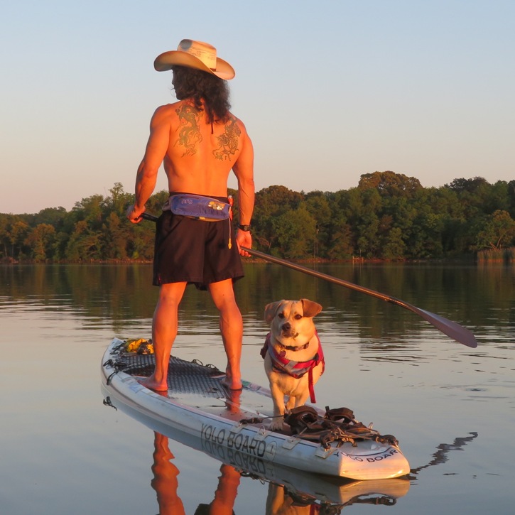 Daphne and me on SUP with Daphne watching Norma take her picture