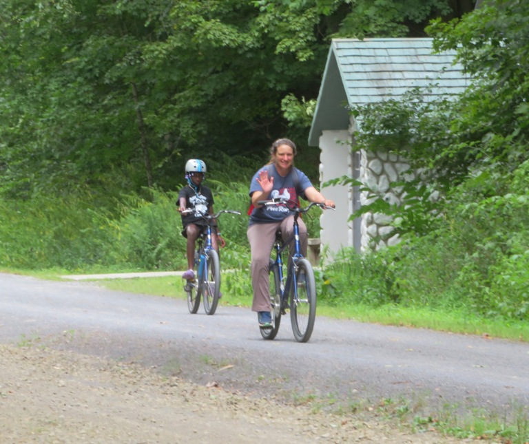 Laah and one of the kids riding.  Laah waving