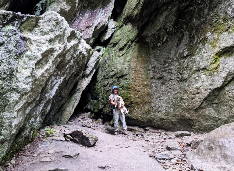 Me holding Daphne in front of big rocks