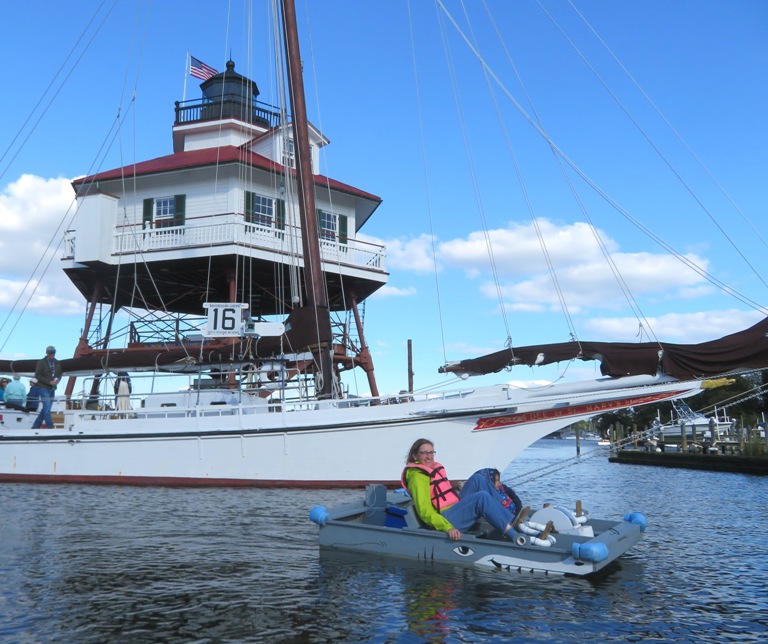 Norma on paddleboat with Dee of Saint Mary's and Drum Point Lighthouse behind