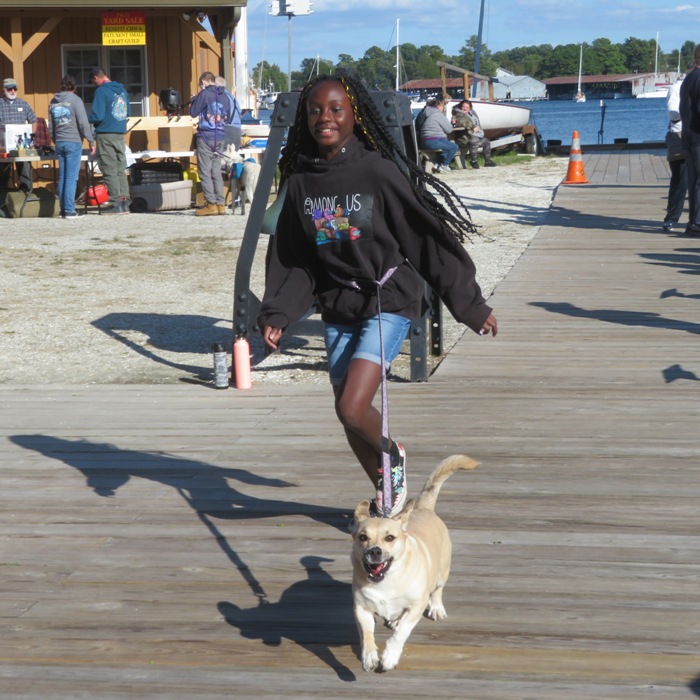 Daphne on leash pulling Norma's niece