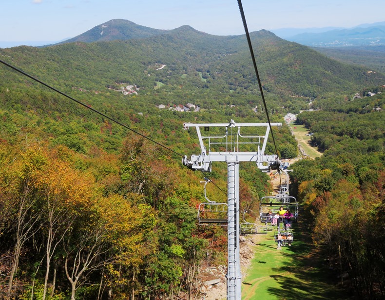 Looking downhill to mountains and some fall colors just starting