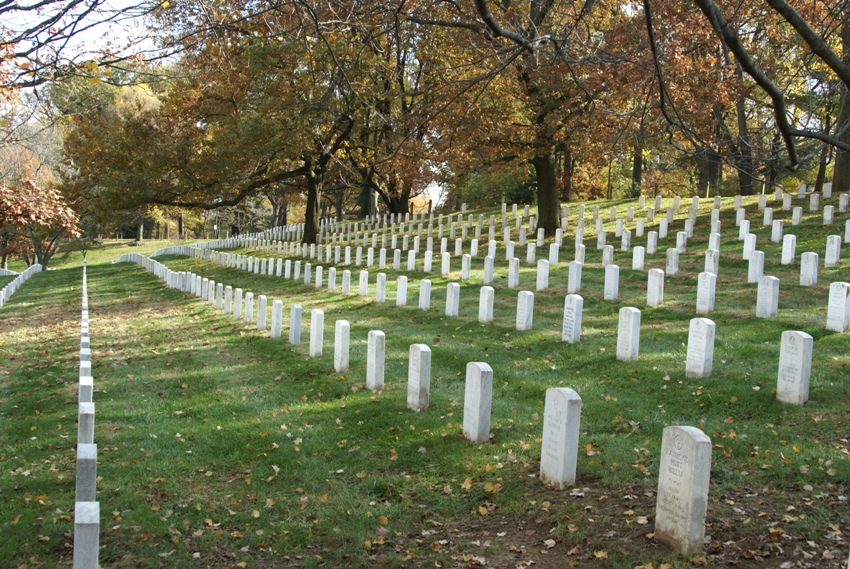 Tombstones stand in formation as once did the men whose names they now carry