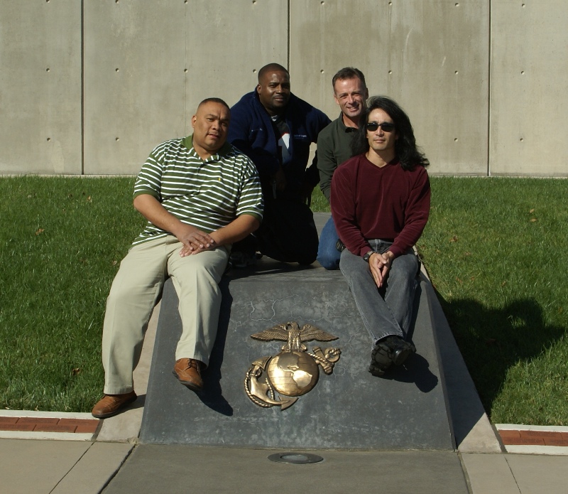 Group pic in front of the museum building with Eagle, Globe, and Anchor symbol